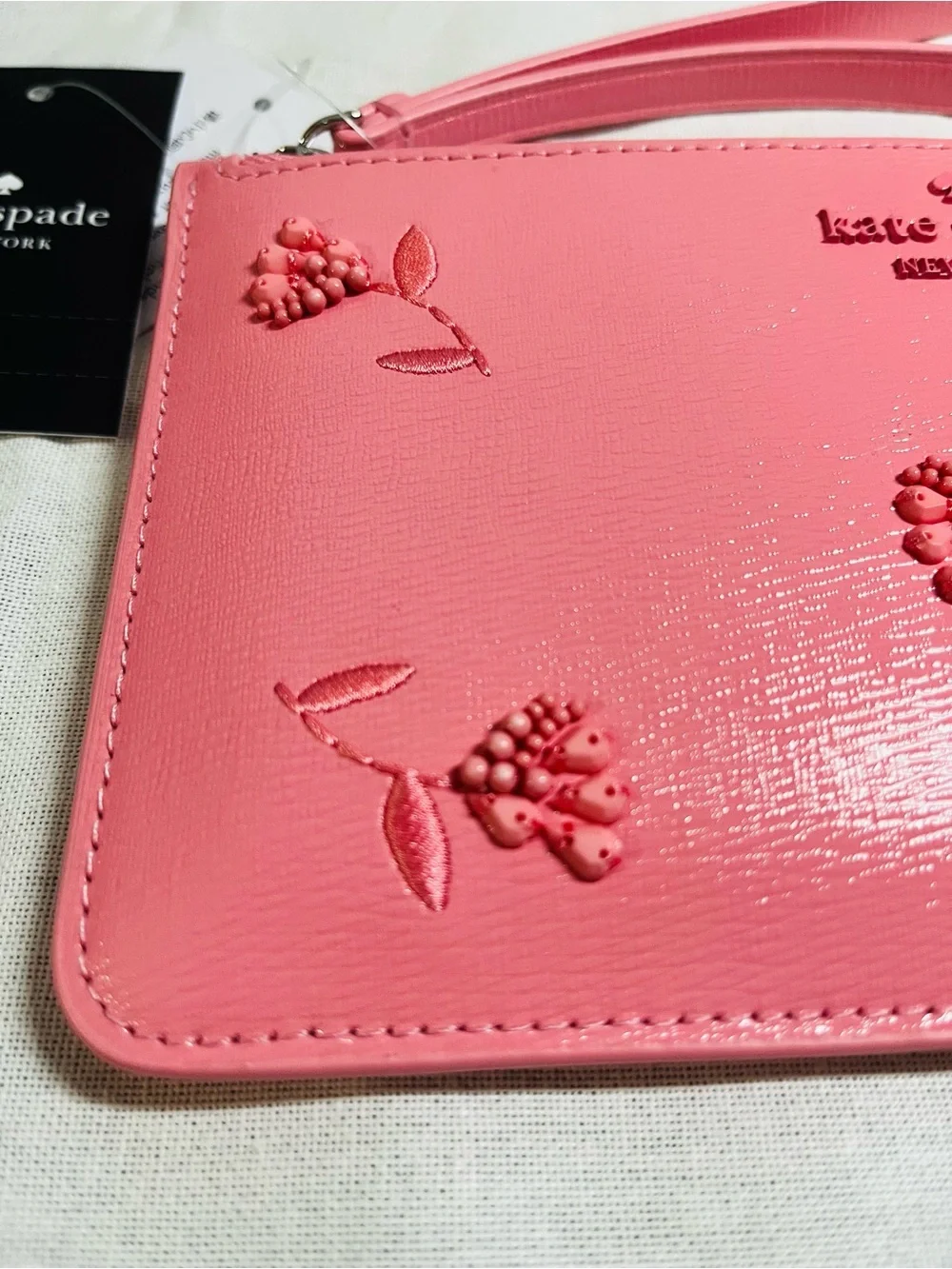 kate spade pink grapefruit soda floral embossed wristlet - NWT